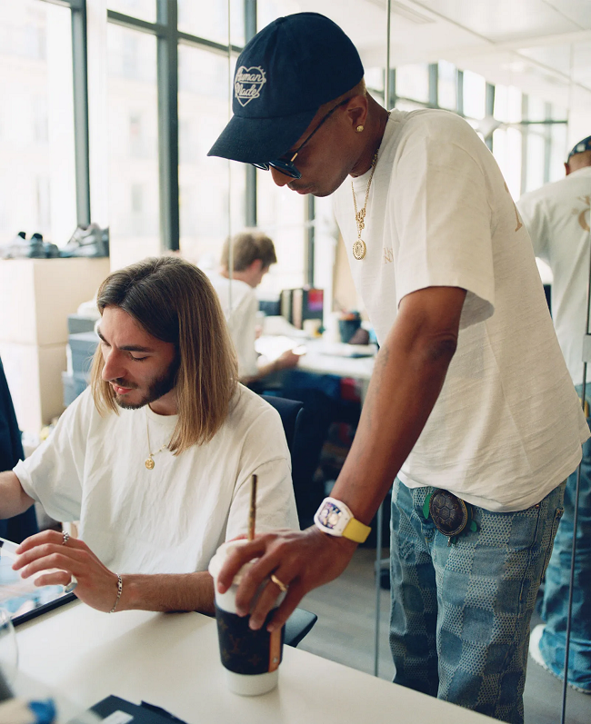 Pharrell Williams stages Louis Vuitton debut on Pont Neuf