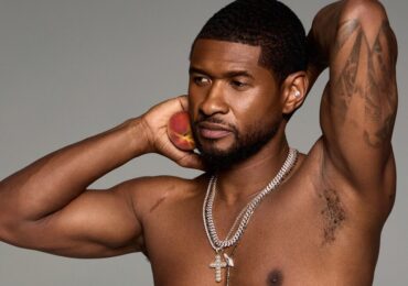 shirtless usher holding a peach