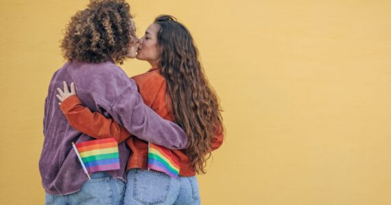 Ways to celebrate pride month - lesbian couple attending pride