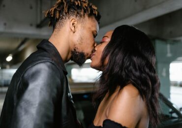 a couple kissing each other
