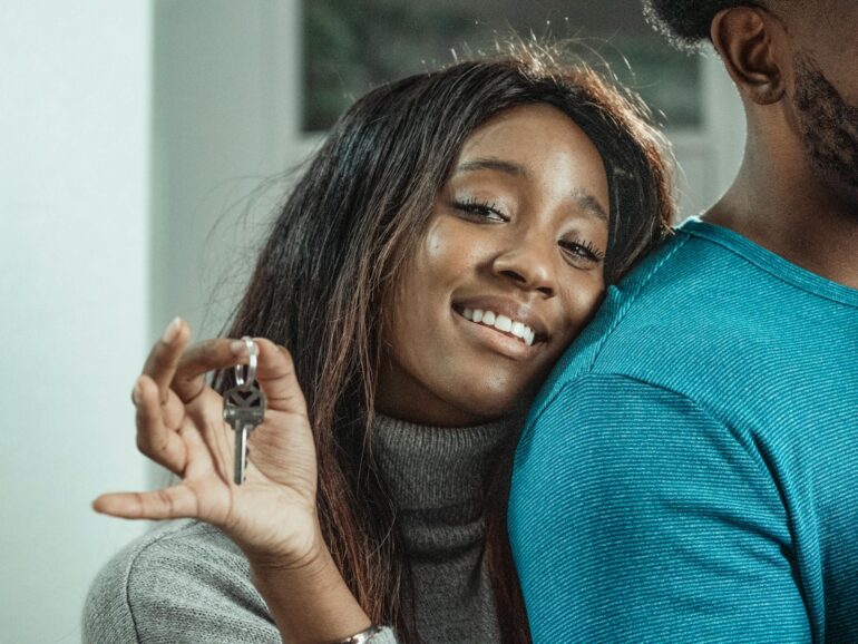 woman in gray sweater smiling
