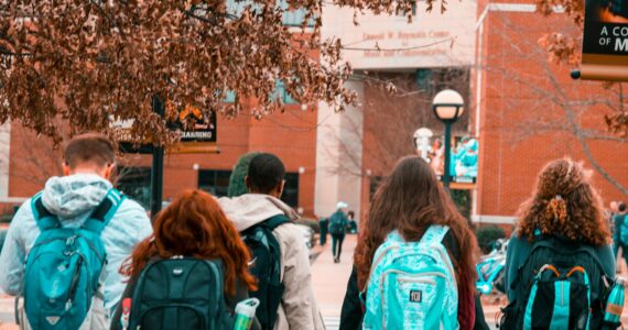 people wearing backpacks